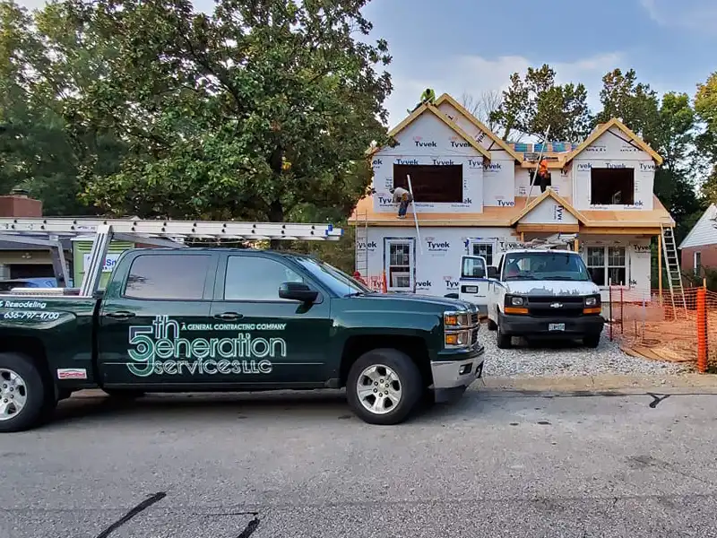 Work truck parked in front of home undergoing renovations